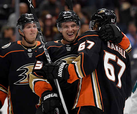 ANAHEIM, CALIFORNIA – SEPTEMBER 24: Jakob Silfverberg #33 of the Anaheim Ducks celebrates his goal with Rickard Rakell #67 and Isac Lundestrom #48 to take a 2-0 lead over the San Jose Sharks during the first period in a preseason game at Honda Center on September 24, 2019 in Anaheim, California. (Photo by Harry How/Getty Images)