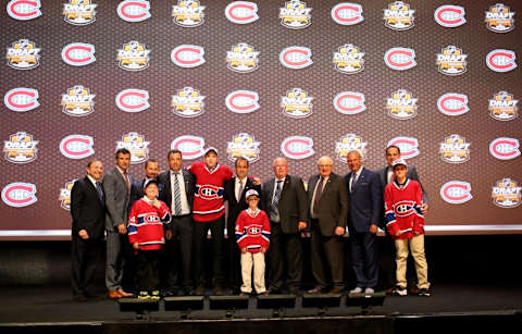 Jun 27, 2014; Philadelphia, PA, USA; Nikita Scherbak poses for a photo with team officials after being selected as the number twenty-six overall pick to the Montreal Canadiens in the first round of the 2014 NHL Draft at Wells Fargo Center. Mandatory Credit: Bill Streicher-USA TODAY Sports