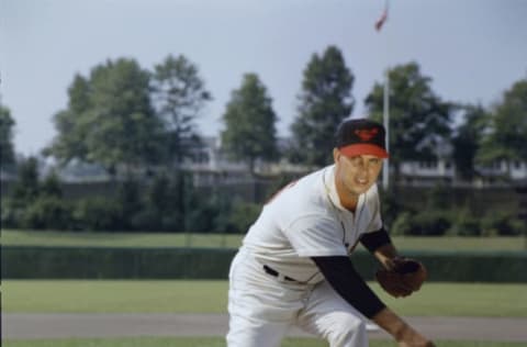 Portrait of American musician Hoyt Wilhelm (1922 – 2002), pitcher of the Baltimore Orioles, at Memorial Stadium, Baltimore, Maryland, 1958. At fore is a baseball on a nearly invisible stand. (Photo by Hank Walker/The LIFE Picture Collection/Getty Images)