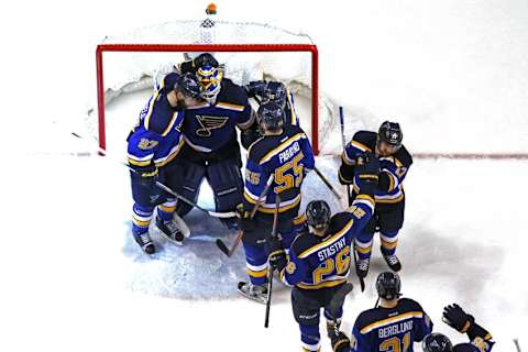 May 15, 2016; St. Louis, MO, USA; St. Louis Blues goalie Brian Elliott (1) is congratulated by teammates after defeating the San Jose Sharks in game one of the Western Conference Final of the 2016 Stanley Cup Playoffs at Scottrade Center. The Blues won the game 2-1. Mandatory Credit: Billy Hurst-USA TODAY Sports