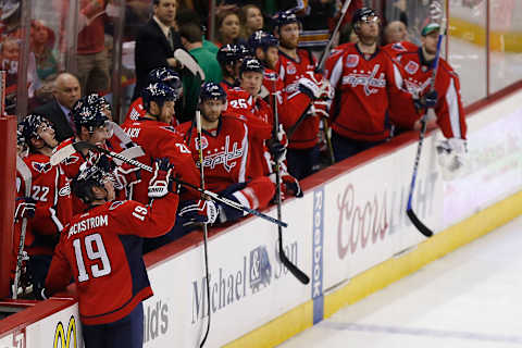 Mar 15, 2015; Washington, DC, USA; Washington Capitals center Nicklas Backstrom (19) waves to the crowd after assisting on a goal by Washington Capitals defenseman John Carlson (not pictured) against the Boston Bruins in the first period at Verizon Center. Backstrom became the franchise’s all-time assist leader on the play. Mandatory Credit: Geoff Burke-USA TODAY Sports