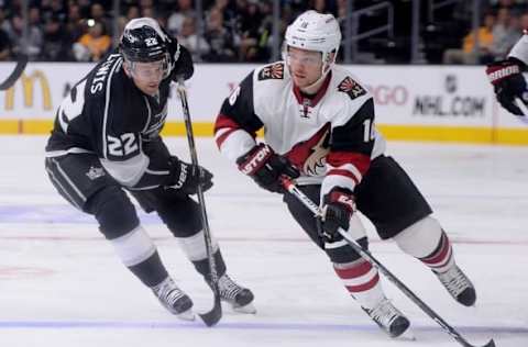 Sep 22, 2015; Los Angeles, CA, USA; Los Angeles Kings center Trevor Lewis (22) chases Arizona Coyotes left wing Max Domi (16) in the first period at Staples Center. Mandatory Credit: Jayne Kamin-Oncea-USA TODAY Sports