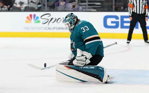 SAN JOSE, CALIFORNIA – DECEMBER 07: Adin Hill #33 of the San Jose Sharks makes a save against the Calgary Flames in the first period at SAP Center on December 07, 2021 in San Jose, California. (Photo by Ezra Shaw/Getty Images)