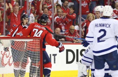 Apr 21, 2017; Washington, DC, USA; Washington Capitals right wing T.J. Oshie (77) celebrates with Capitals defenseman John Carlson (74) after scoring a goal against the Toronto Maple Leafs in the first period in game five of the first round of the 2017 Stanley Cup Playoffs at Verizon Center. Mandatory Credit: Geoff Burke-USA TODAY Sports