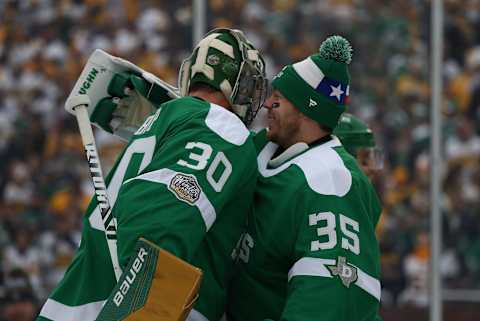 DALLAS, TEXAS – JANUARY 01: Ben Bishop #30 and Anton Khudobin #35 of the Dallas Stars celebrate a 4-2 win against the Nashville Predators during the 2020 Bridgestone NHL Winter Classic at Cotton Bowl on January 01, 2020 in Dallas, Texas. (Photo by Ronald Martinez/Getty Images)