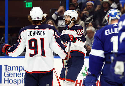 Dec 15, 2022; Tampa, Florida, USA; Columbus Blue Jackets right wing Kirill Marchenko (86) is congratulated by Columbus Blue Jackets center Kent Johnson (91) after he scored a goal against the Tampa Bay Lightning during the second period at Amalie Arena. Mandatory Credit: Kim Klement-USA TODAY Sports