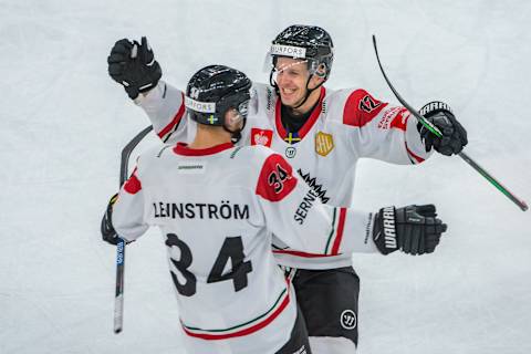 BIEL, SWITZERLAND – DECEMBER 10: #34 Theodor Lennstrom of Frolunda HF celebrates his goal with #12 Max Friberg of Frolunda HF during the second quarter-finals game between EHC Biel-Bienne and Frolunda Indians at Tissot-Arena on December 10, 2019 in Biel, Switzerland. (Photo by RvS.Media/Robert Hradil/Getty Images)