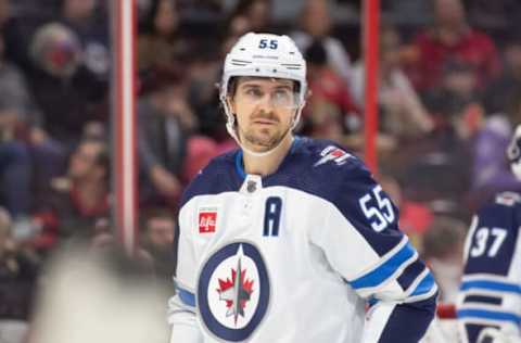 Jan 21, 2023; Ottawa, Ontario, CAN; Winnipeg Jets center Mark Scheifele (55) gets ready for a face-off in the first period against the Ottawa Senators at the Canadian Tire Centre. Mandatory Credit: Marc DesRosiers-USA TODAY Sports