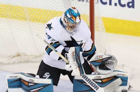 NHL Power Rankings: San Jose Sharks goalie Aaron Dell (30) makes a save during the second period against the Winnipeg Jets at MTS Centre. Mandatory Credit: Bruce Fedyck-USA TODAY Sports