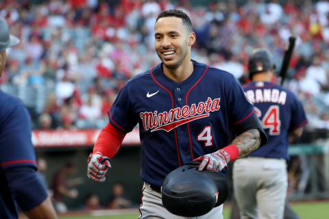 Aug 13, 2022; Anaheim, California, USA; Minnesota Twins shortstop Carlos Correa (4) is greeted by a teammate after hitting a home run in the first inning against the Los Angeles Angels at Angel Stadium. Mandatory Credit: Kiyoshi Mio-USA TODAY Sports