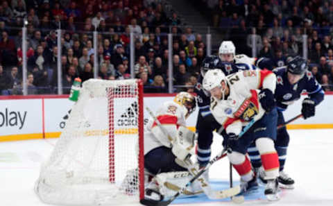 HELSINKI, FINLAND – NOVEMBER 02: Vincent Trocheck #21 of the Florida Panthers battles for the puck against Blake Wheeler #26 and Mark Scheifele #55 of the Winnipeg Jets in front of the net in the third period during the 2018 NHL Global Series game at Hartwall Arena on November 2, 2018 in Helsinki, Finland. (Photo by Patrick McDermott/NHLI via Getty Images)