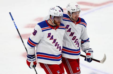 Jun 11, 2022; Tampa, Florida, USA; New York Rangers center Andrew Copp (18) celebrates with center Frank Vatrano (77) after scoring a goal against the Tampa Bay Lightning in the third period in game six of the Eastern Conference Final of the 2022 Stanley Cup Playoffs at Amalie Arena. Mandatory Credit: Nathan Ray Seebeck-USA TODAY Sports