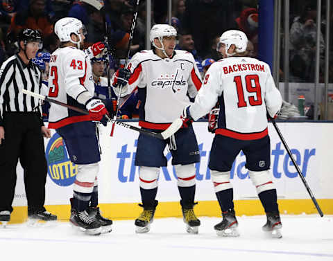 UNIONDALE, NEW YORK – JANUARY 18: Alex Ovechkin #8 of the Washington Capitals celebrates his goal at 10:22 of the first period against the New York Islanders and is joined by Tom Wilson #43 (L) Nicklas Backstrom #19 (R) at NYCB Live’s Nassau Coliseum on January 18, 2020 in Uniondale, New York. With the game, Ovechkin passed Mario Lemieux (690) for the 10th most goal in NHL history. (Photo by Bruce Bennett/Getty Images)