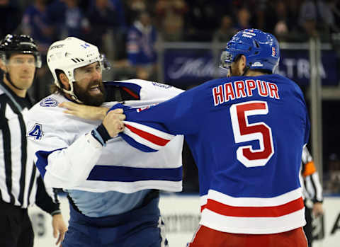 NEW YORK, NEW YORK – APRIL 05: Pat Maroon #14 of the Tampa Bay Lightning and Ben Harpur #5 of the New York Rangers fight during the first period at Madison Square Garden on April 05, 2023 in New York City. (Photo by Bruce Bennett/Getty Images)