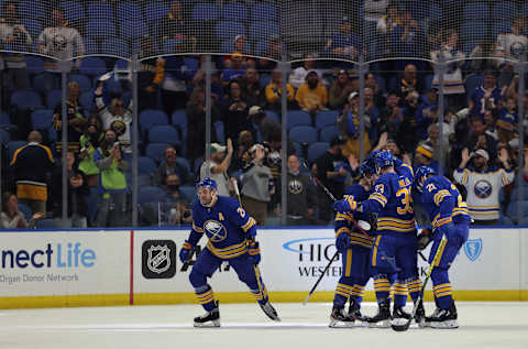 Oct 14, 2021; Buffalo, New York, USA; Buffalo Sabres center Zemgus Girgensons (28) celebrates his goal during the first period against the Montreal Canadiens at KeyBank Center. Mandatory Credit: Timothy T. Ludwig-USA TODAY Sports