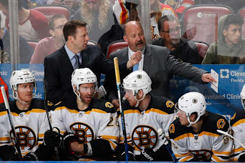 SUNRISE, FL – DECEMBER 22: Head coach Claude Julien talks to assistant coach Joe Sacco of the Boston Bruins during second period action against the Florida Panthers at the BB&T Center on December 22, 2016 in Sunrise, Florida. The Bruins defeated the Panthers 3-1. (Photo by Joel Auerbach/Getty Images)