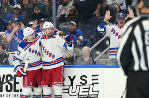 BUFFALO, NY – OCTOBER 12: Alexis Lafreniere #13 of the New York Rangers celebrates his goal against the Buffalo Sabres with Adam Fox #23 during the first period at KeyBank Center on October 12, 2023, in Buffalo, New York. (Photo by Kevin Hoffman/Getty Images)