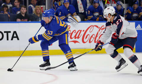 Sep 30, 2023; Buffalo, New York, USA; Columbus Blue Jackets defenseman Adam Boqvist (27) looks to defend as Buffalo Sabres left wing Jeff Skinner (53) skates with the puck during the second period at KeyBank Center. Mandatory Credit: Timothy T. Ludwig-USA TODAY Sports