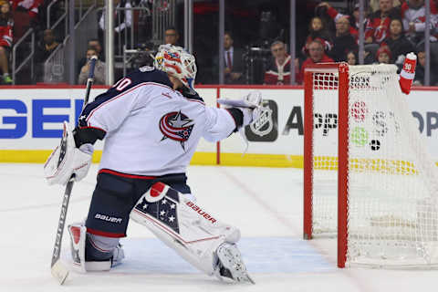 Oct 30, 2022; Newark, New Jersey, USA; New Jersey Devils defenseman John Marino (6) (not shown) scores a goal on Columbus Blue Jackets goaltender Elvis Merzlikins (90) during the second period at Prudential Center. Mandatory Credit: Ed Mulholland-USA TODAY Sports