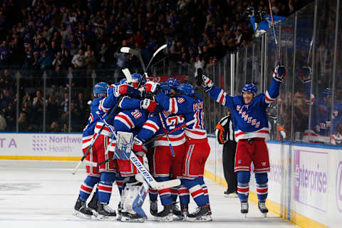 The New York Rangers celebrate after defeating the Minnesota Wild