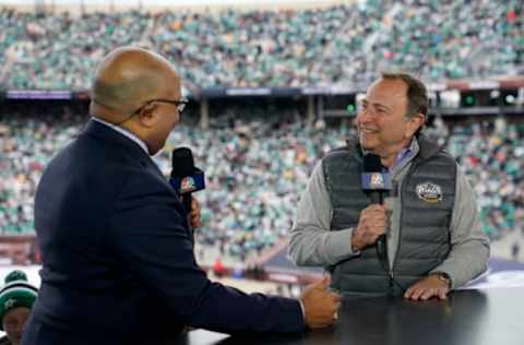 DALLAS, TEXAS – JANUARY 01: NBC Sportscaster Mike Tirico speaks with NHL Commissioner Gary Bettman during the second intermission of the 2020 NHL Winter Classic between the Nashville Predators and the Dallas Stars at Cotton Bowl on January 01, 2020, in Dallas, Texas. (Photo by Patrick McDermott/NHLI via Getty Images)