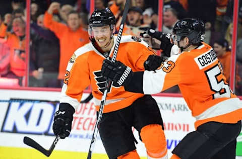 Nov 15, 2016; Philadelphia, PA, USA; Philadelphia Flyers left wing Michael Raffl (12) celebrates his goal with defenseman Shayne Gostisbehere (53) against the Ottawa Senators during the second period at Wells Fargo Center. Mandatory Credit: Eric Hartline-USA TODAY Sports