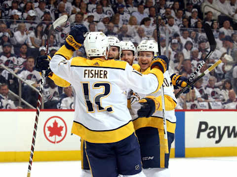 WINNIPEG, MB – MAY 3: Mike Fisher #12, Ryan Hartman #38, Yannick Weber #7 and Miikka Salomaki #20 of the Nashville Predators celebrate a first period goal against the Winnipeg Jets in Game Four of the Western Conference Second Round during the 2018 NHL Stanley Cup Playoffs at the Bell MTS Place on May 3, 2018 in Winnipeg, Manitoba, Canada. (Photo by Jonathan Kozub/NHLI via Getty Images)