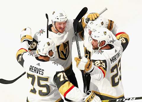 Shea Theodore #27 of the Vegas Golden Knights (2nd from right) celebrates his goal at 13:58 of the first period against the Chicago Blackhawks in Game Four of the Western Conference First Round. (Photo by Jeff Vinnick/Getty Images)