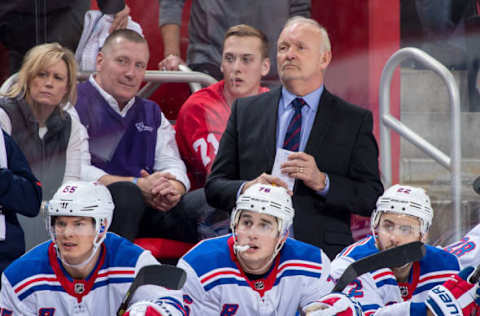 DETROIT, MI – DECEMBER 29: Assistant coach Lindy Ruff of the New York Rangers watches the action from the bench against the Detroit Red Wings during an NHL game at Little Caesars Arena on December 29, 2017 in Detroit, Michigan. The Wings defeated the Rangers 3-2 in a shootout. (Photo by Dave Reginek/NHLI via Getty Images)