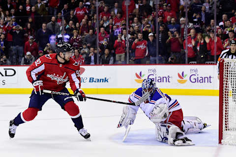 WASHINGTON, DC – MARCH 28: Henrik Lundqvist #30 of the New York Rangers makes a save against Evgeny Kuznetsov #92 of the Washington Capitals on a penalty shot in the first period at Capital One Arena on March 28, 2018 in Washington, DC. (Photo by Patrick McDermott/NHLI via Getty Images)