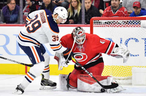 RALEIGH, NORTH CAROLINA – FEBRUARY 16: James Reimer #47 of the Carolina Hurricanes stops a shot by Alex Chiasson #39 of the Edmonton Oilers during the second period of their game at PNC Arena on February 16, 2020 in Raleigh, North Carolina. (Photo by Grant Halverson/Getty Images)