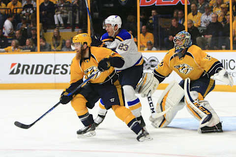 NASHVILLE, TN – MAY 07: Nashville Predators defenseman Ryan Ellis (4) defends against St. Louis Blues winger Dmitrij Jaskin (23) in front of goalie Pekka Rinne (35) during Game Six of Round Two of the Stanley Cup Playoffs between the Nashville Predators and the St. Louis Blues, held on May 7, 2017, at Bridgestone Arena in Nashville, Tennessee. (Photo by Danny Murphy/Icon Sportswire via Getty Images)