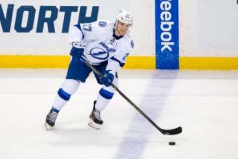 Nov 7, 2015; Saint Paul, MN, USA; Tampa Bay Lightning forward Jonathan Drouin (27) passes in the second period against the Minnesota Wild at Xcel Energy Center. Mandatory Credit: Brad Rempel-USA TODAY Sports