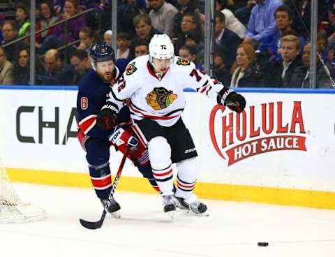 Feb 17, 2016; New York, NY, USA; Chicago Blackhawks left wing Artemi panarin (72) and New York Rangers defenseman Kevin Klein (8) pursue a loose puck during the third period at Madison Square Garden. The Blackhawks defeated the Rangers 5-3. Mandatory Credit: Andy Marlin-USA TODAY Sports