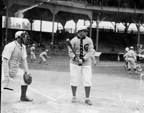 American baseball player Joe Tinker (1880 – 1948) of the Chicago Cubs stands at the plate during batting practice on the field at West Side Grounds, Chicago, Illinois, 1909. An unidentified catcher stands behind him. (Photo by Chicago History Museum/Getty Images)