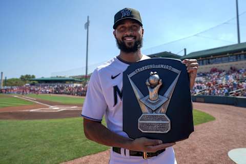 JUPITER, FL – FEBRUARY 26: Sandy Alcantara #22 of the Miami Marlins poses for a picture with his 2022 National Leauge CY Young award prior to the game against the St. Louis Cardinals at Roger Dean Stadium on February 26, 2023 in Jupiter, Florida. (Photo by Jasen Vinlove/Miami Marlins/Getty Images)