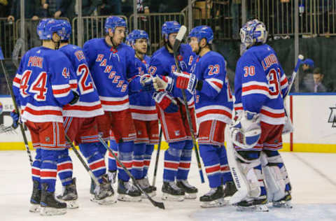 NEW YORK, NY – NOVEMBER 12: Rangers players congratulate New York Rangers goaltender Henrik Lundqvist (30) after winning the Vancouver Canucks and New York Rangers NHL game on November 12, 2018, at Madison Square Garden in New York, NY. (Photo by John Crouch/Icon Sportswire via Getty Images)