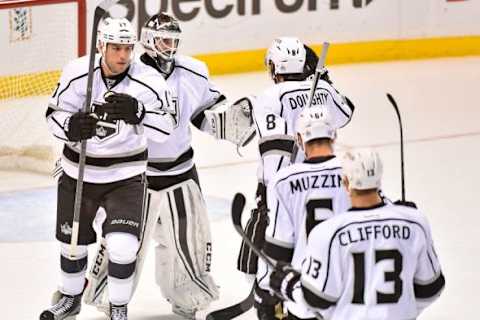 Nov 3, 2015; St. Louis, MO, USA; Los Angeles Kings teammates celebrate defeating the St. Louis Blues 3-0 at Scottrade Center. Mandatory Credit: Jasen Vinlove-USA TODAY Sports