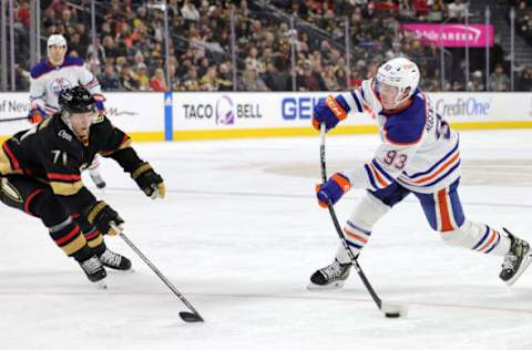 LAS VEGAS, NEVADA – JANUARY 14: Ryan Nugent-Hopkins #93 of the Edmonton Oilers takes a shot as William Karlsson #71 of the Vegas Golden Knights defends in the first period of their game at T-Mobile Arena on January 14, 2023 in Las Vegas, Nevada. The Oilers defeated the Golden Knights 4-3. (Photo by Ethan Miller/Getty Images)