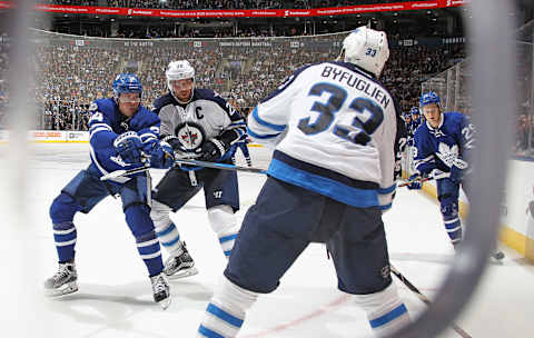 TORONTO,ON – FEBRUARY 21: Dustin Byfuglien #33 of the Winnipeg Jets looks to clear a puck out against the Toronto Maple Leafs during an NHL game at Air Canada Centre on February 21, 2017 in London, Ontario, Canada. The Maple Leafs defeated the Jets 5-4 in overtime. (Photo by Claus Andersen/Getty Images)