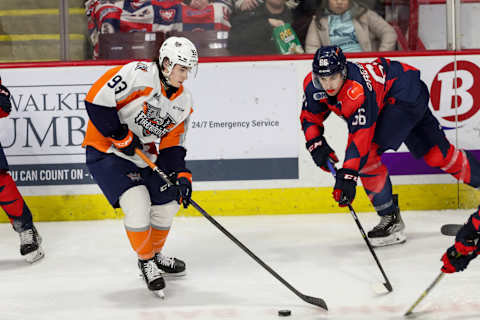 WINDSOR, ONTARIO – FEBRUARY 16: Forward Amadeus Lombardi #93 of the Flint Firebirds moves the puck against forward Liam Greentree #66 of the Windsor Spitfires at WFCU Centre on February 16, 2023 in Windsor, Ontario. (Photo by Dennis Pajot/Getty Images)