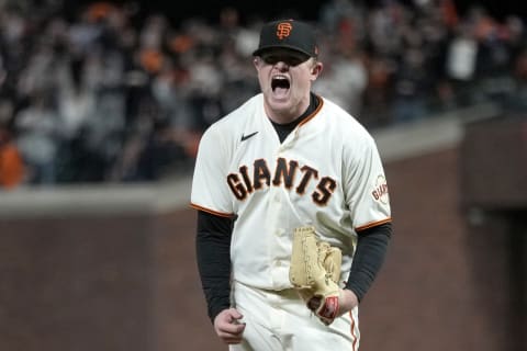 SAN FRANCISCO, CALIFORNIA – OCTOBER 14: Logan Webb #62 of the San Francisco Giants reacts after striking out Cody Bellinger #35 of the Los Angeles Dodgers at the top of the seventh inning in game 5 of the National League Division Series at Oracle Park on October 14, 2021 in San Francisco, California. (Photo by Thearon W. Henderson/Getty Images)