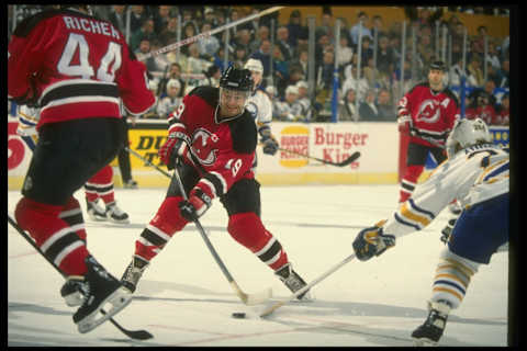 25 Jan 1994: Leftwinger Bob Carpenter of the New Jersey Devils (center) moves the puck during a game against the Buffalo Sabres at Memorial Auditorium in Buffalo, New York. The Sabres won the game, 2-1. Mandatory Credit: Rick Stewart /Allsport