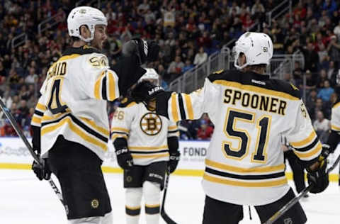 Oct 4, 2016; Quebec City, Quebec, CAN; Boston Bruins forward Ryan Spooner (51) celebrates with Adam McQuaid (54) after scoring a goal against the Montreal Canadiens during the first period of a preseason hockey game at Centre Videotron. Mandatory Credit: Eric Bolte-USA TODAY Sports