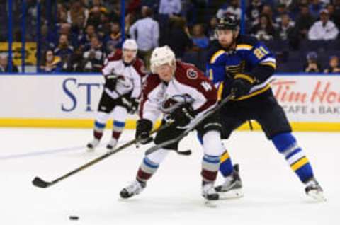 Mar 29, 2016; St. Louis, MO, USA; Colorado Avalanche defenseman Tyson Barrie (4) skates with the puck as St. Louis Blues center Patrik Berglund (21) defends during the third period at Scottrade Center. The Blues won 3-1. Mandatory Credit: Jeff Curry-USA TODAY Sports