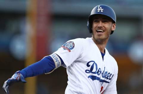 LOS ANGELES, CA – AUGUST 02: Cody Bellinger #35 of the Los Angeles Dodgers reacts as he rounds first base after hitting a grand slam homerun during the third inning of the MLB game against the Milwaukee Brewers at Dodger Stadium on August 2, 2018 in Los Angeles, California. (Photo by Victor Decolongon/Getty Images)