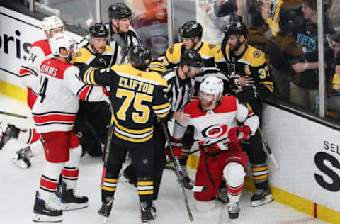 BOSTON, MASSACHUSETTS – MAY 12: Referees break up a scrum during the third period between the Carolina Hurricanes and the Boston Bruins in Game Two of the Eastern Conference Final during the 2019 NHL Stanley Cup Playoffs at TD Garden on May 12, 2019 in Boston, Massachusetts. (Photo by Adam Glanzman/Getty Images)