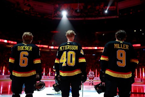 J.T. Miller #9, Elias Pettersson #40 and Brock Boeser #6 (Photo by Jeff Vinnick/NHLI via Getty Images)