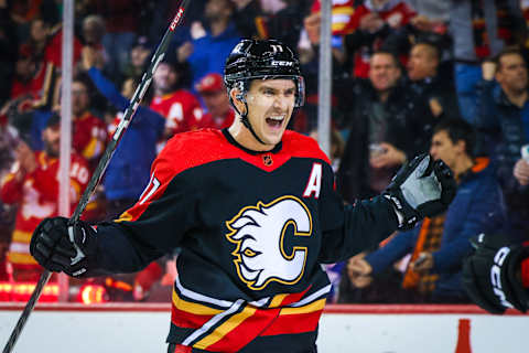 Dec 14, 2022; Calgary, Alberta, CAN; Calgary Flames center Mikael Backlund (11) celebrates his goal against the Vancouver Canucks during the first period at Scotiabank Saddledome. Mandatory Credit: Sergei Belski-USA TODAY Sports