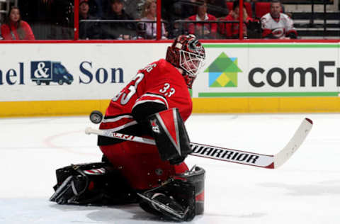 RALEIGH, NC – MARCH 20: Scott Darling #33 of the Carolina Hurricanes deflects the puck away from the crease during an NHL game against the Edmonton Oilers on March 20, 2018 at PNC Arena in Raleigh, North Carolina. (Photo by Gregg Forwerck/NHLI via Getty Images)